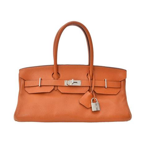 hermes orange shoulder bag.